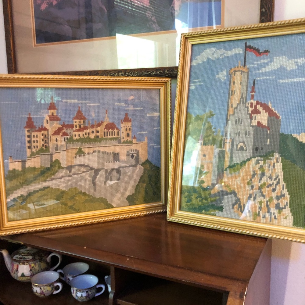 Pair of pristine, vintage gold framed needlepoint castles under glass.